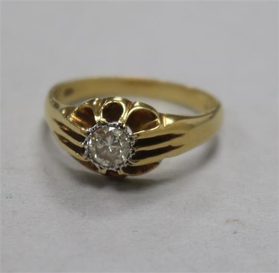 A 1960s 18ct gold and claw set solitaire diamond ring, size S.